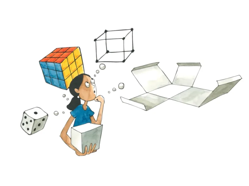 A child exploring a cube and geometric shapes